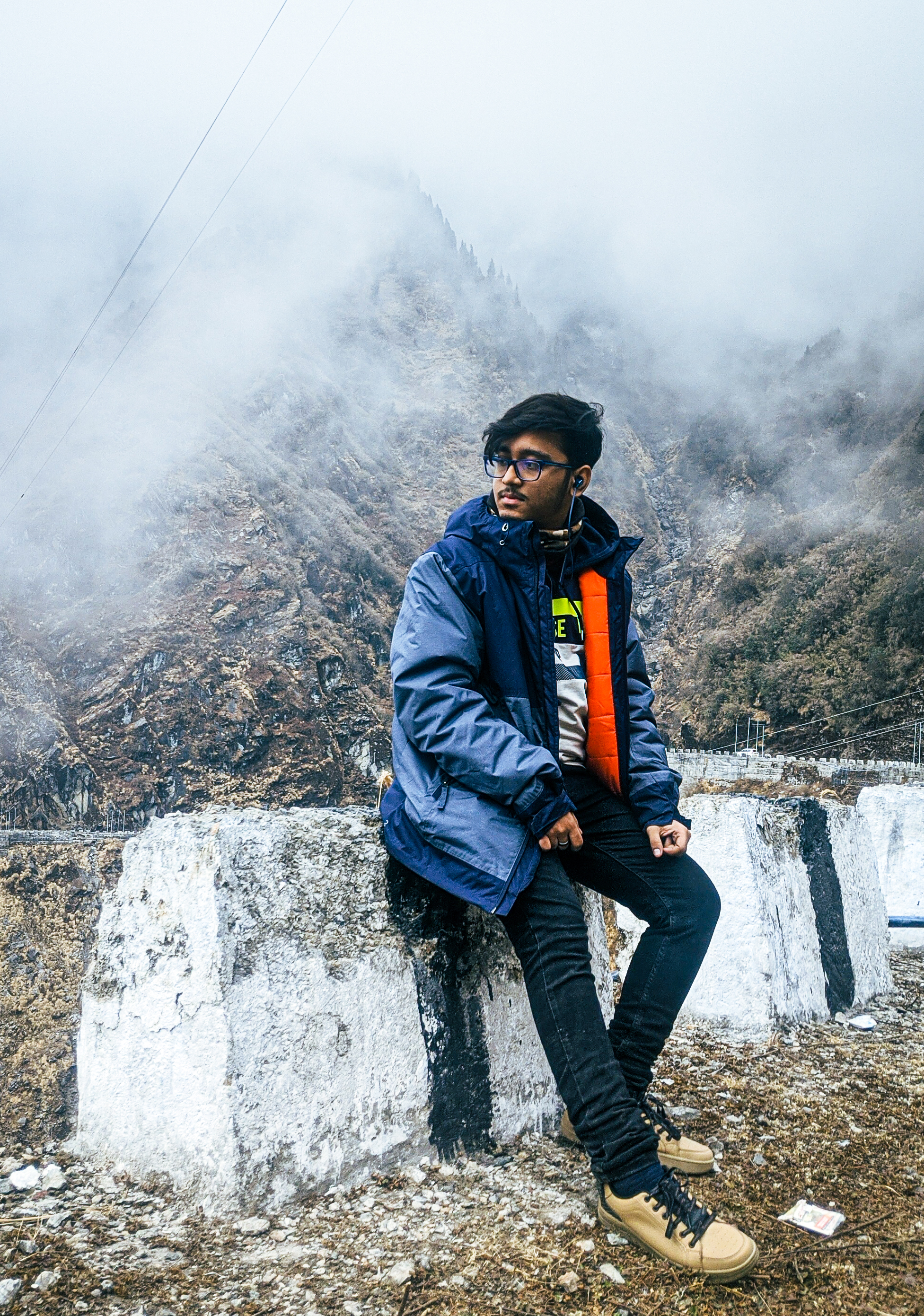 image of sourasish standing at the hill station road